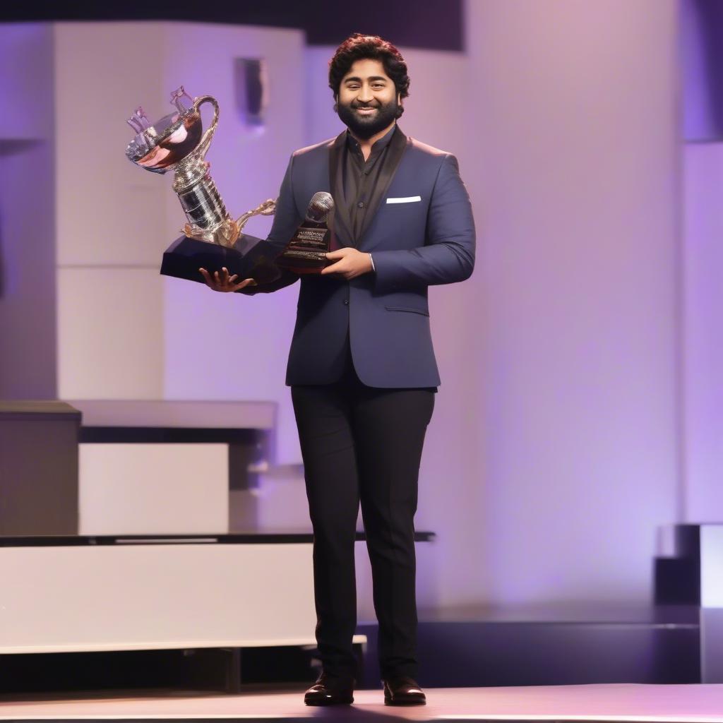 Arijit Singh receiving an award