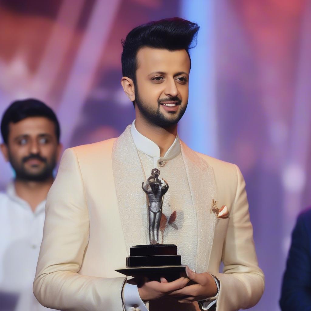 Atif Aslam Receiving a Music Award