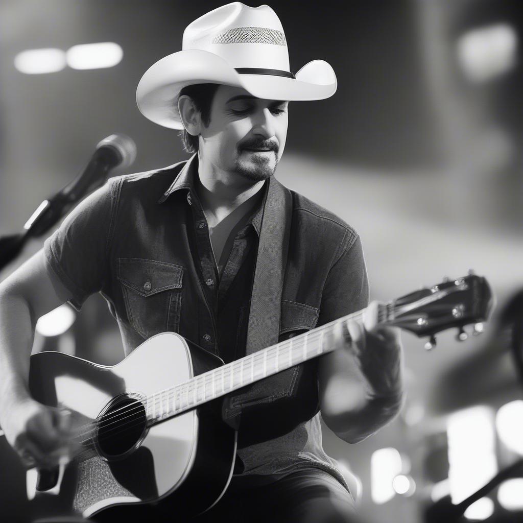 Brad Paisley playing an acoustic guitar