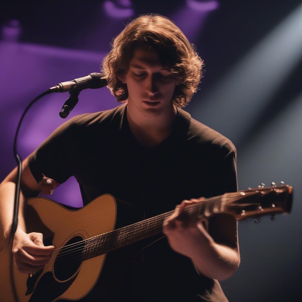 Dean Lewis performing "Chemicals" live, connecting with the audience through his emotive performance.