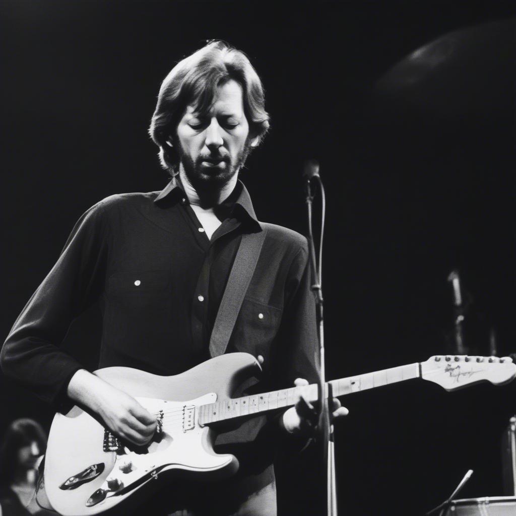 Eric Clapton playing guitar during a Derek and the Dominos performance