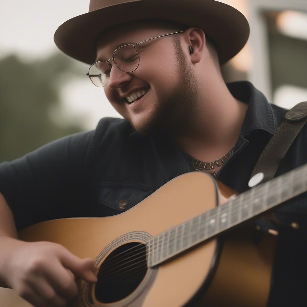 Mitchell Tenpenny playing guitar