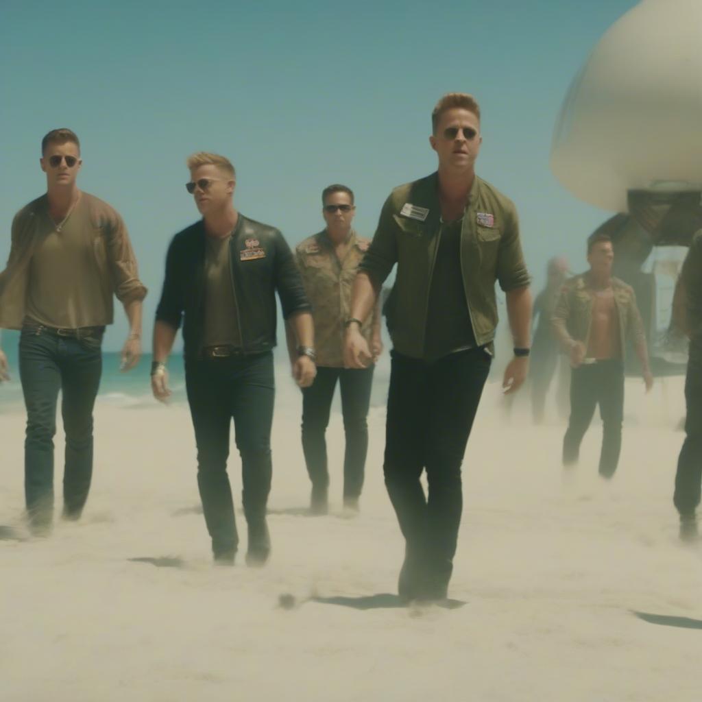 OneRepublic band members performing "I Ain’t Worried", superimposed over a still from the Top Gun: Maverick beach scene.