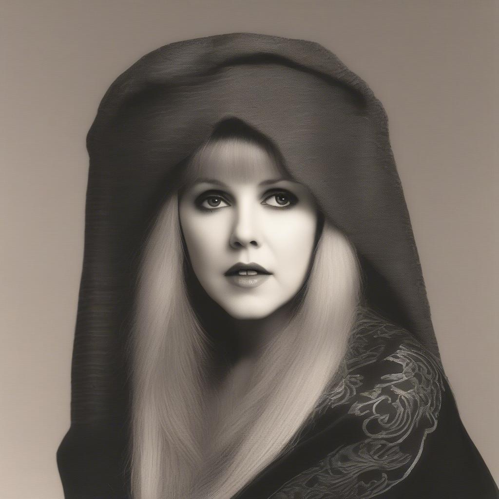 Stevie Nicks performing Landslide, bathed in soft stage lighting.