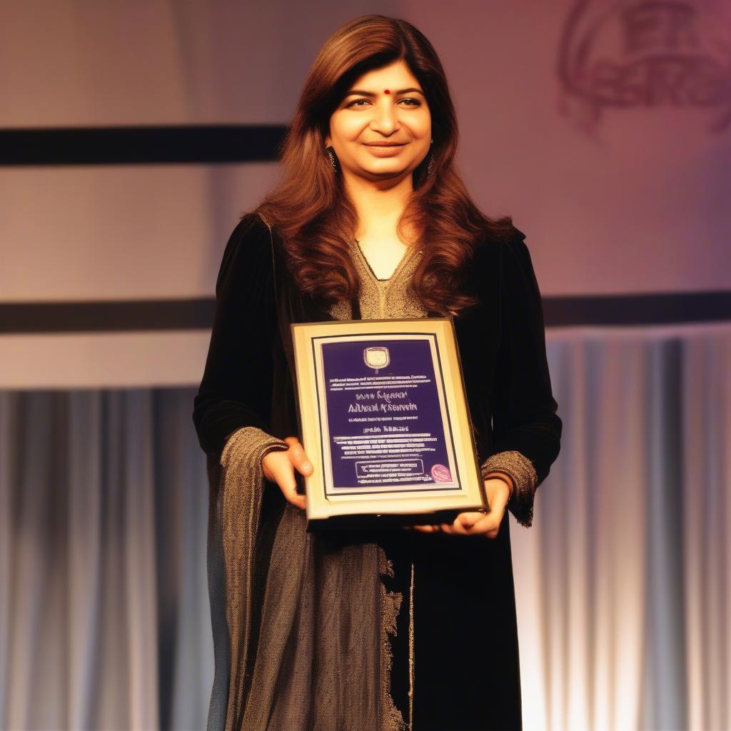 Alka Yagnik receiving a music award