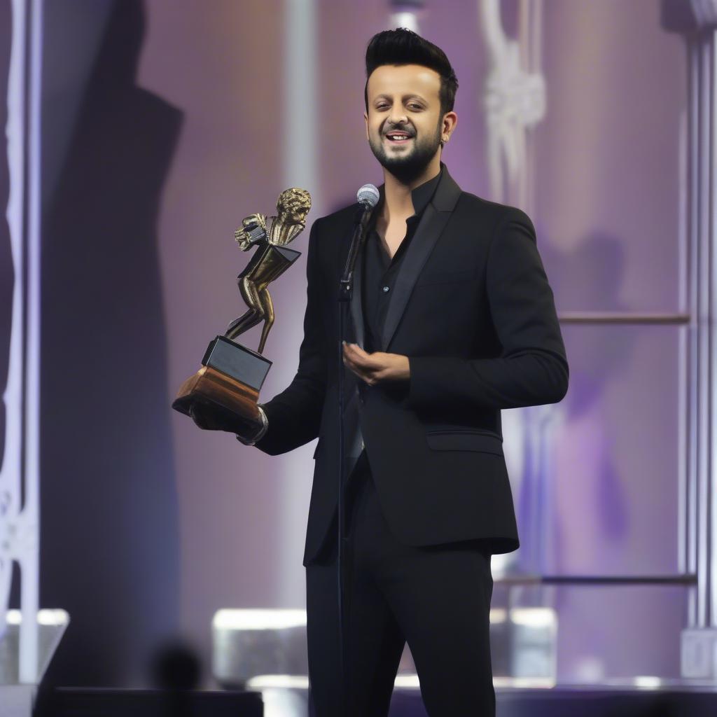 Atif Aslam receiving a music award