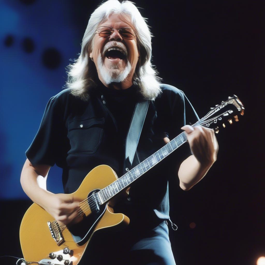 Bob Seger playing guitar on stage