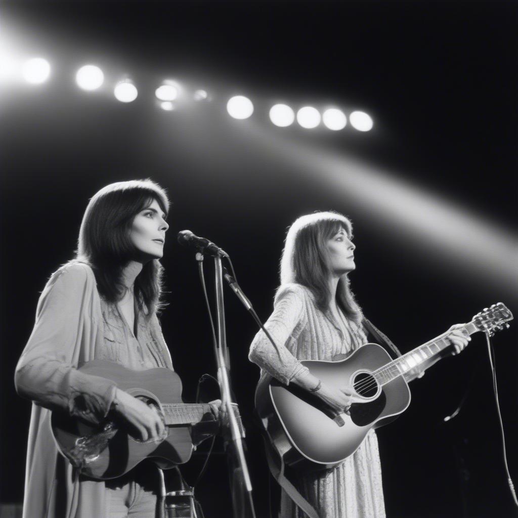 Emmylou Harris and Gram Parsons performing a duet on stage, showcasing their close musical partnership.