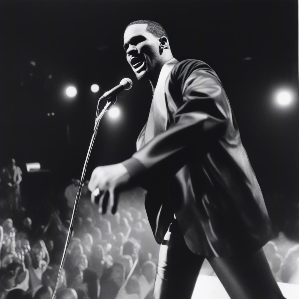 R Kelly performing on stage during his early career in the 1990s