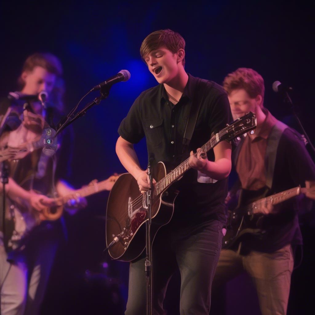 Parker McCollum singing "To Be Loved By You" with a band.