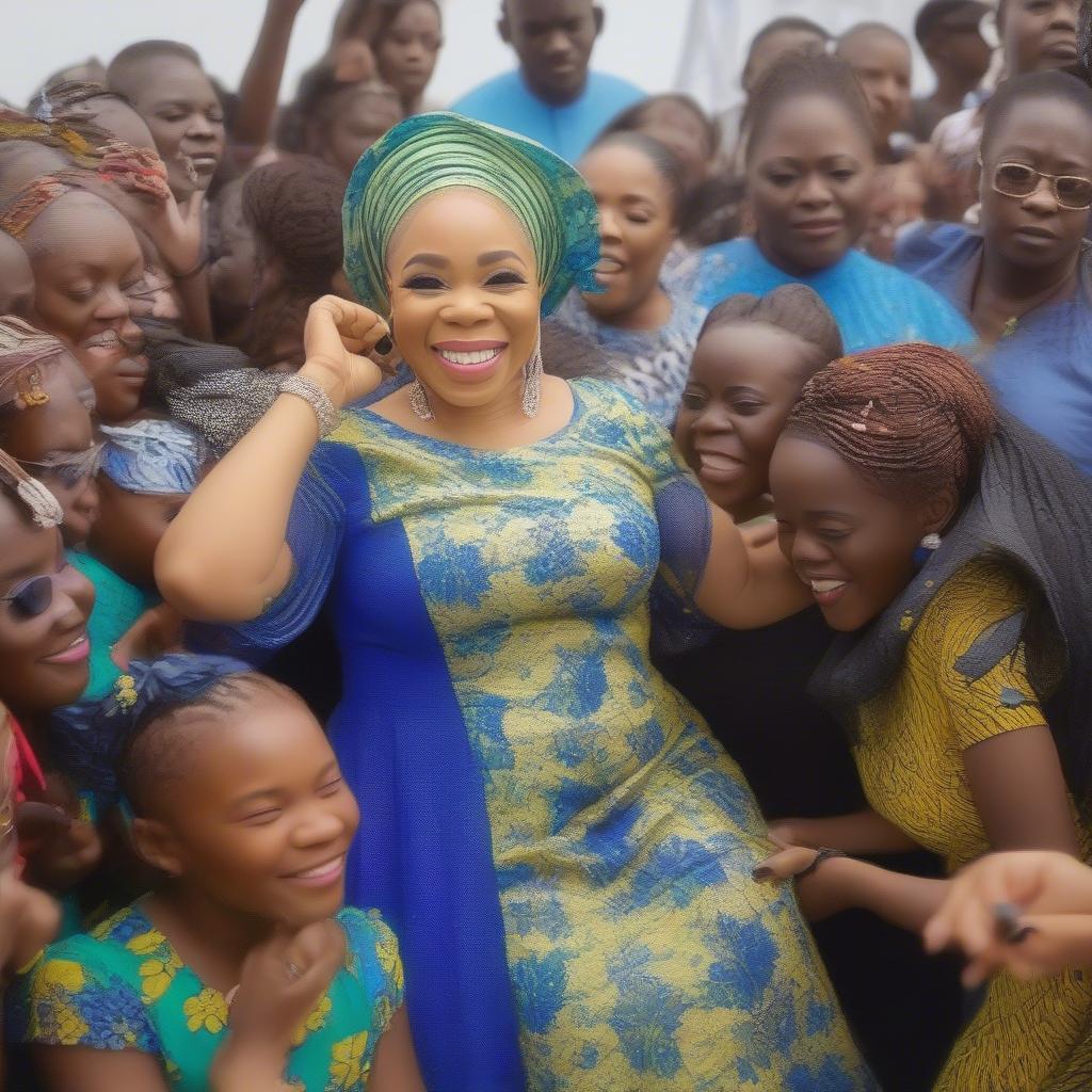 Tope Alabi interacting with fans, signing autographs and taking photos.